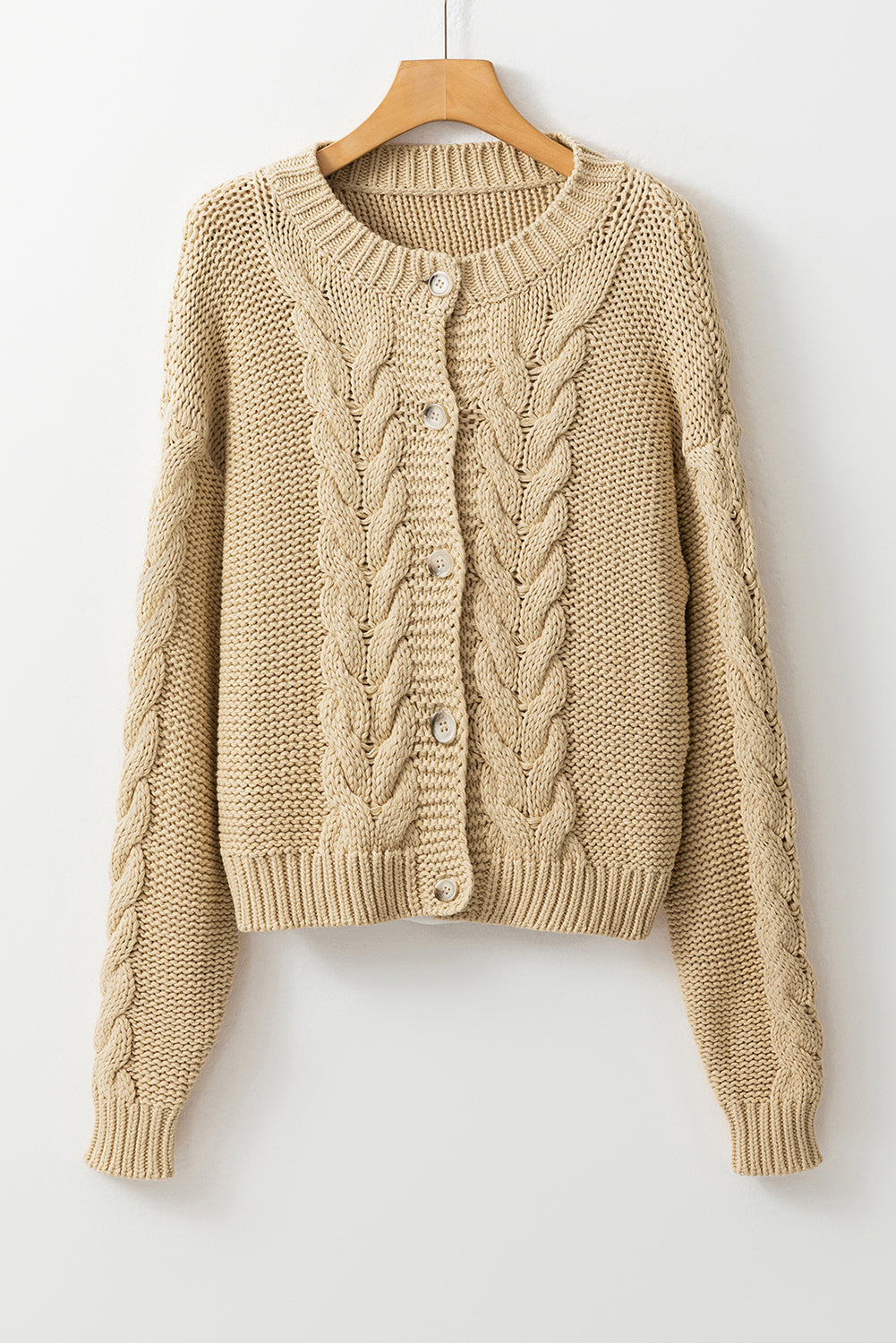 Apricot Cable Knit Buttoned Cardigan featuring a classic round neck, buttoned front, and cozy knit texture, perfect for cold weather styling.