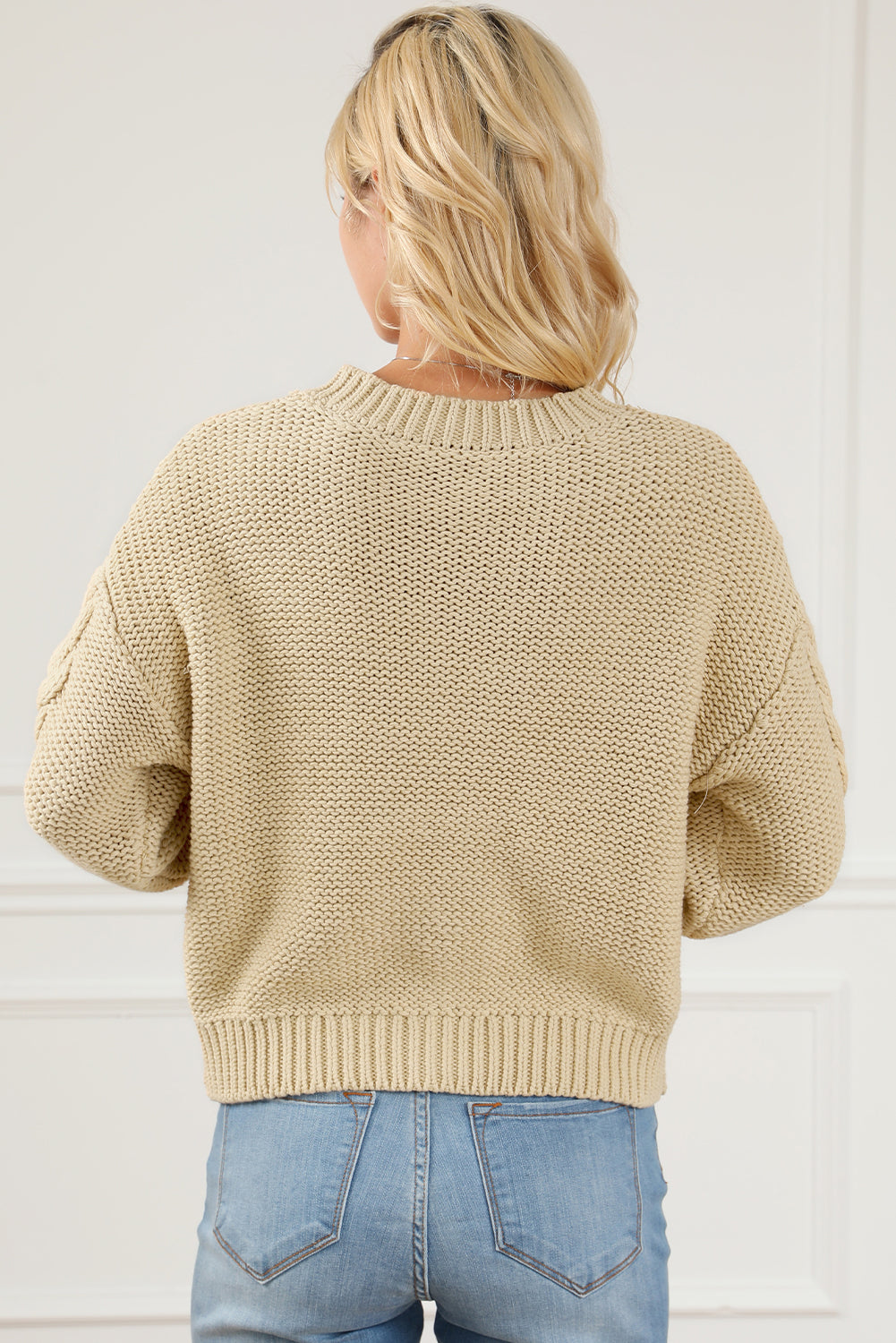 Apricot Cable Knit Buttoned Cardigan featuring a classic round neck, buttoned front, and cozy knit texture, perfect for cold weather styling.