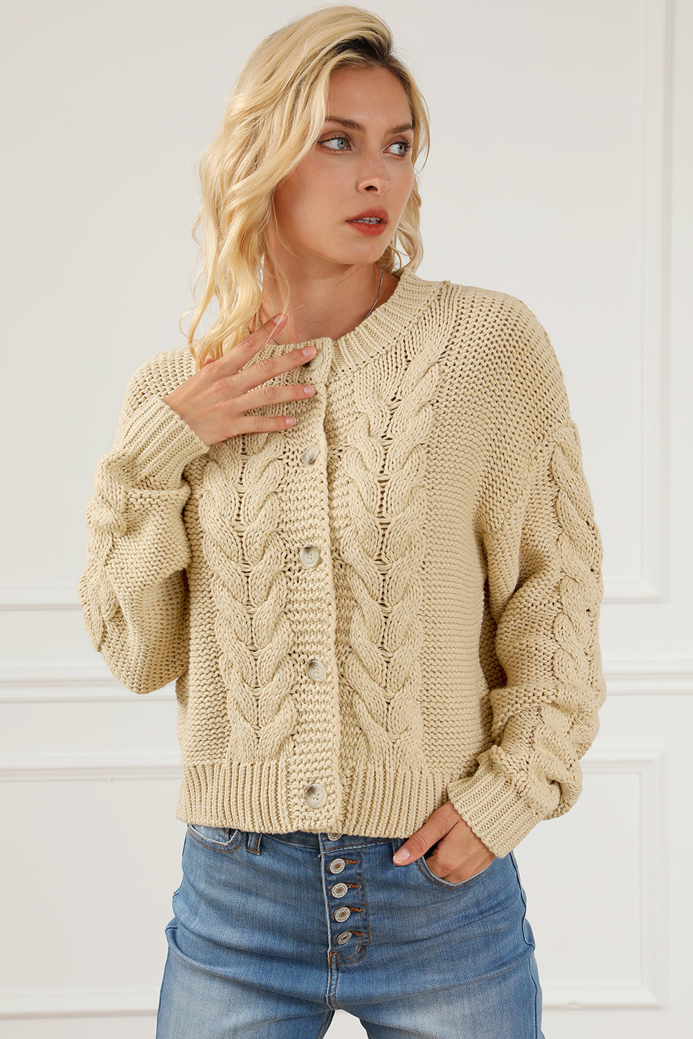 Apricot Cable Knit Buttoned Cardigan featuring a classic round neck, buttoned front, and cozy knit texture, perfect for cold weather styling.