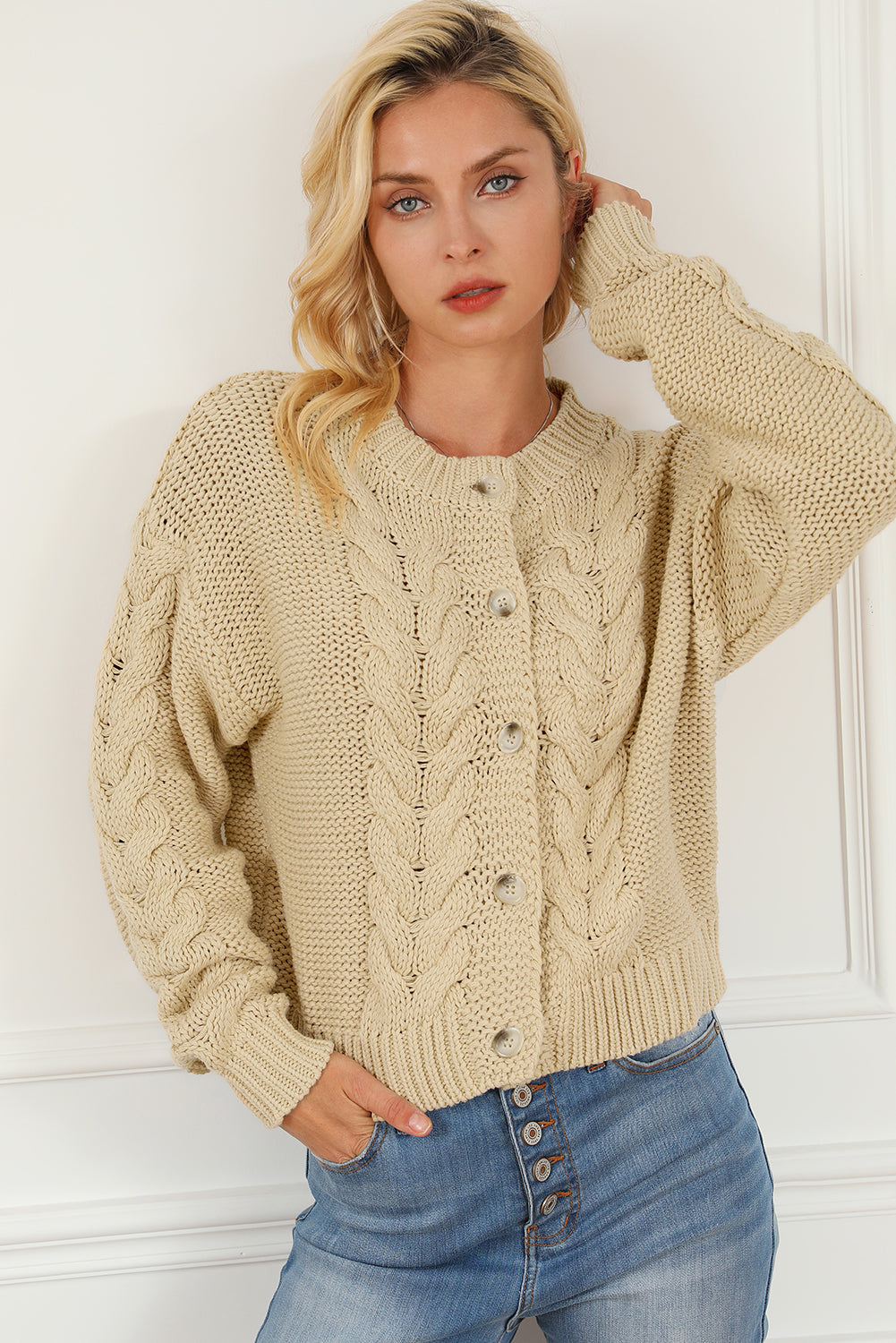 Apricot Cable Knit Buttoned Cardigan featuring a classic round neck, buttoned front, and cozy knit texture, perfect for cold weather styling.