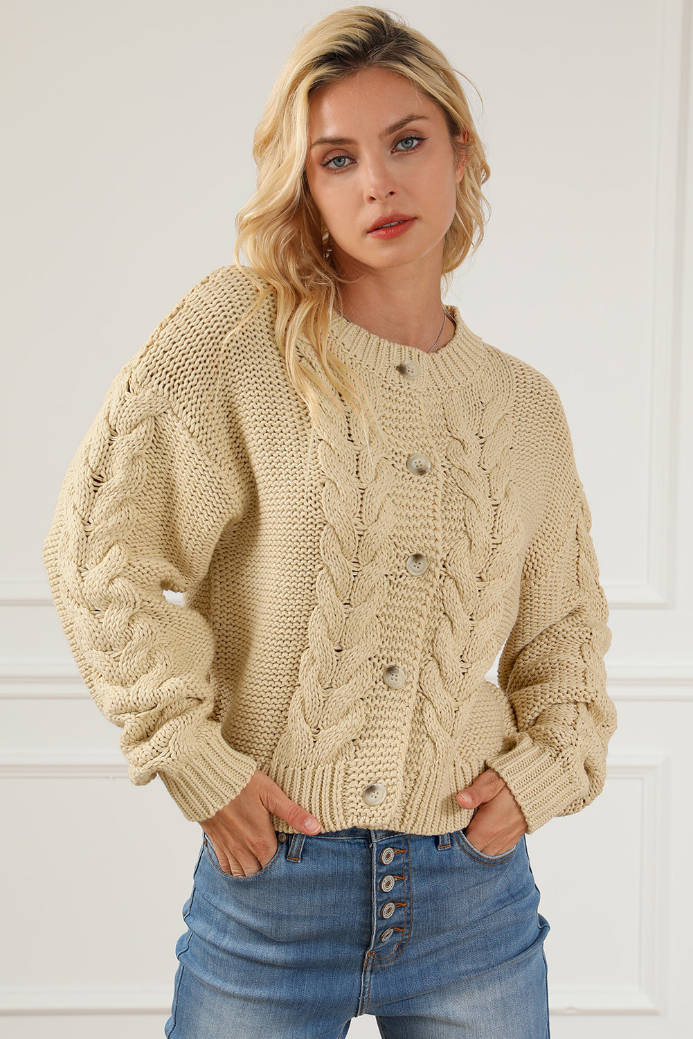 Apricot Cable Knit Buttoned Cardigan featuring a classic round neck, buttoned front, and cozy knit texture, perfect for cold weather styling.