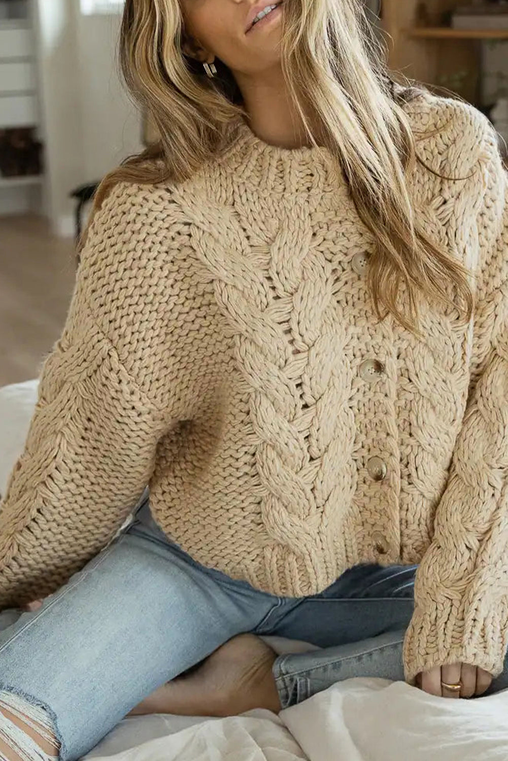 Apricot Cable Knit Buttoned Cardigan featuring a classic round neck, buttoned front, and cozy knit texture, perfect for cold weather styling.