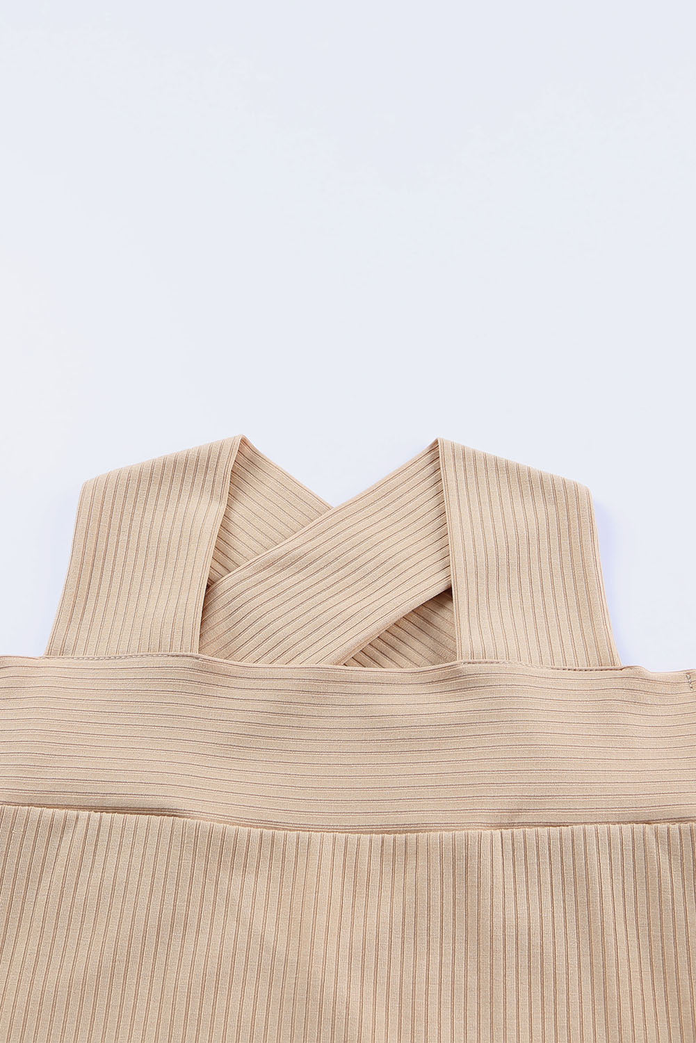 Apricot Cut Out Criss Cross Cold Shoulder Ribbed Top showcasing stylish design and ribbed texture.