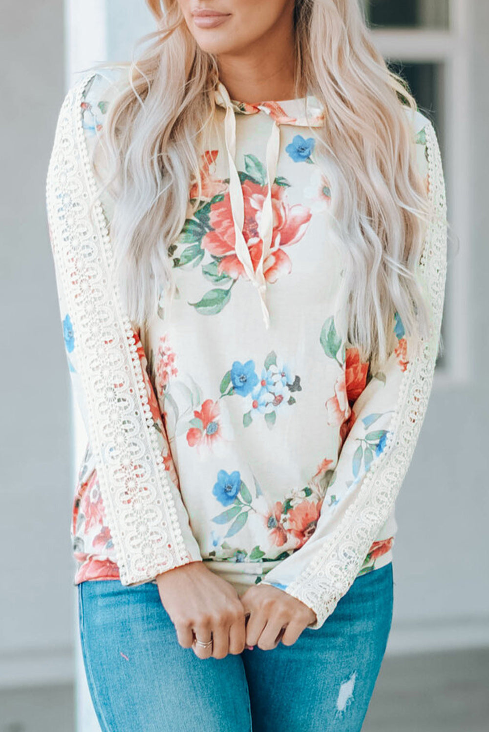 Apricot floral print hoodie with lace contrast, featuring long sleeves and a stylish design, perfect for casual wear.