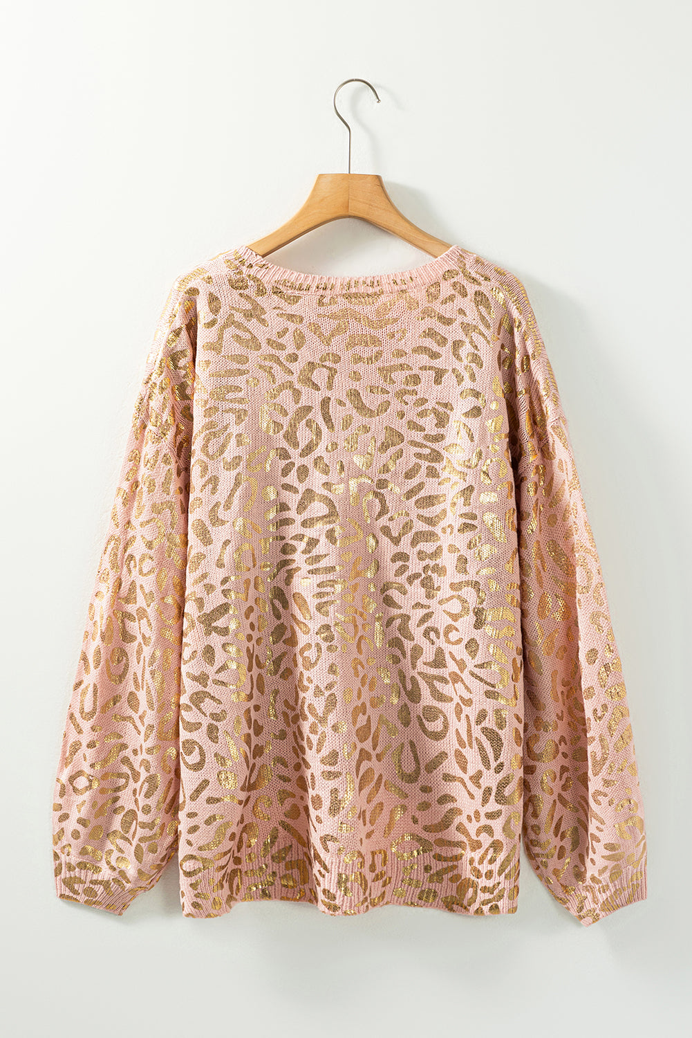 Apricot Glitter Leopard Print Puff Sleeve Sweater showcasing stylish design with puff sleeves and leopard print pattern.