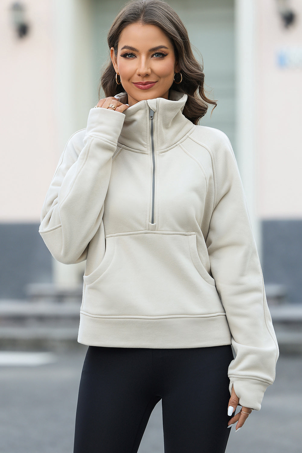 Apricot half zipper kangaroo pocket sweatshirt with thumb holes, showcasing a stylish and active design.