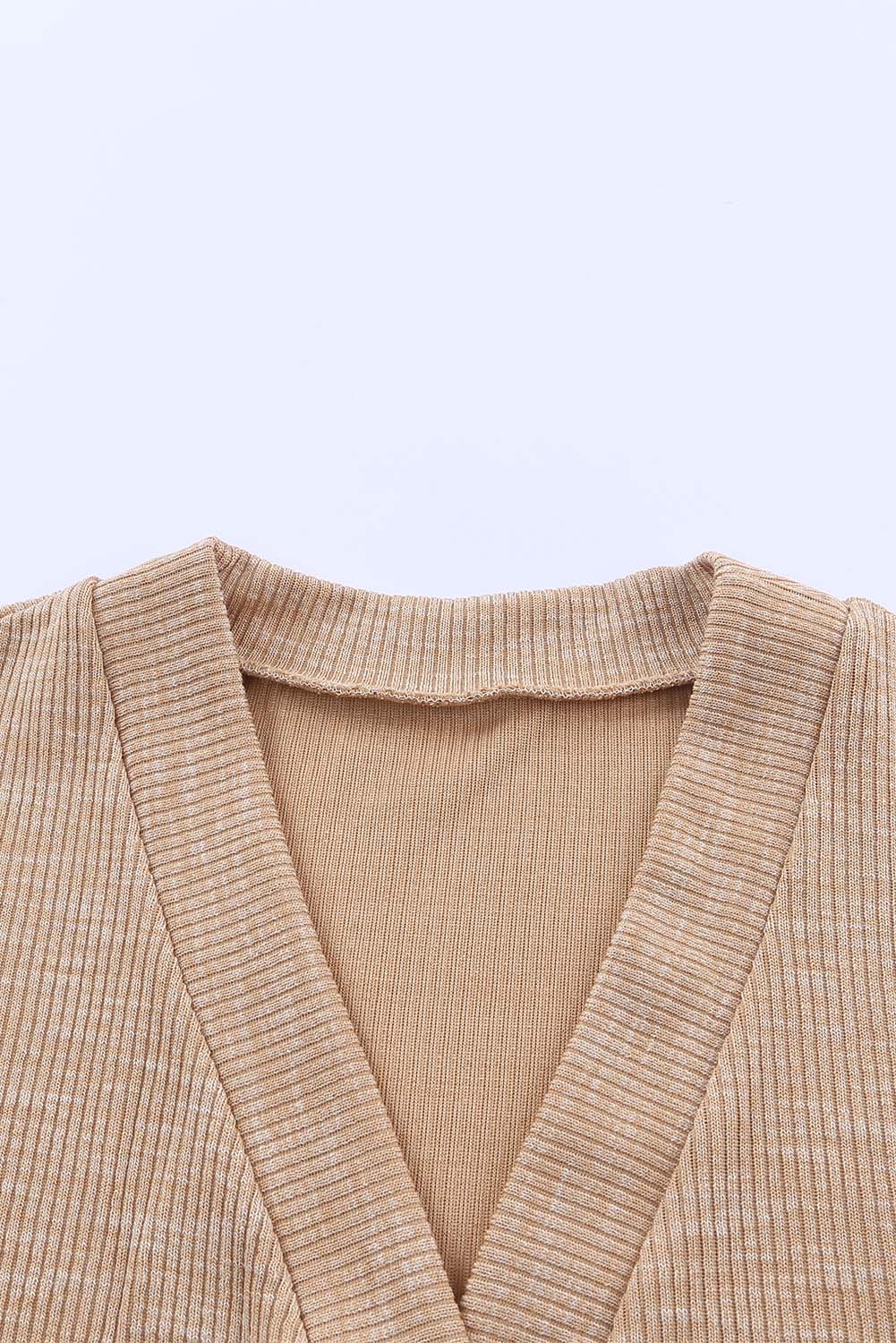 Apricot ribbed cardigan with buttons and V-neck design, perfect for layering and stylish outfits.