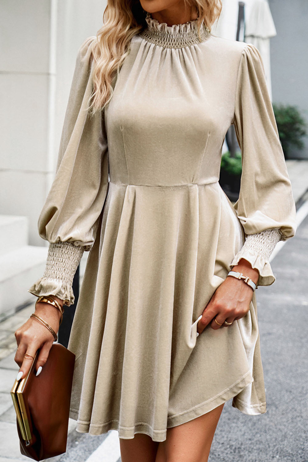 Apricot mini dress featuring a shirred collar and bubble sleeves, perfect for stylish occasions.