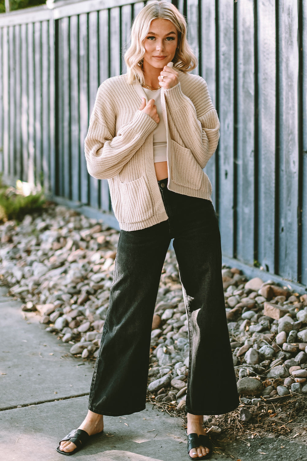 Apricot solid pocketed open short cardigan displayed on a mannequin, showcasing its stylish design and two convenient pockets.