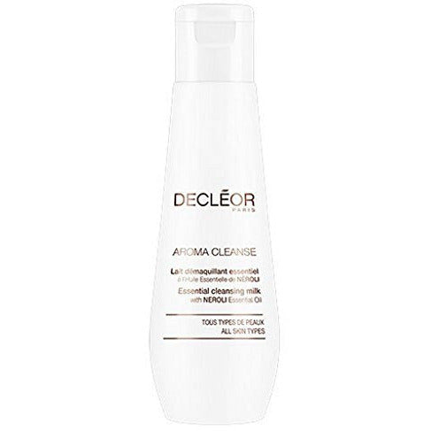 Decléor Aroma Cleanse Essential Cleansing Milk bottle with a sleek design, suitable for all skin types, placed on a marble countertop.