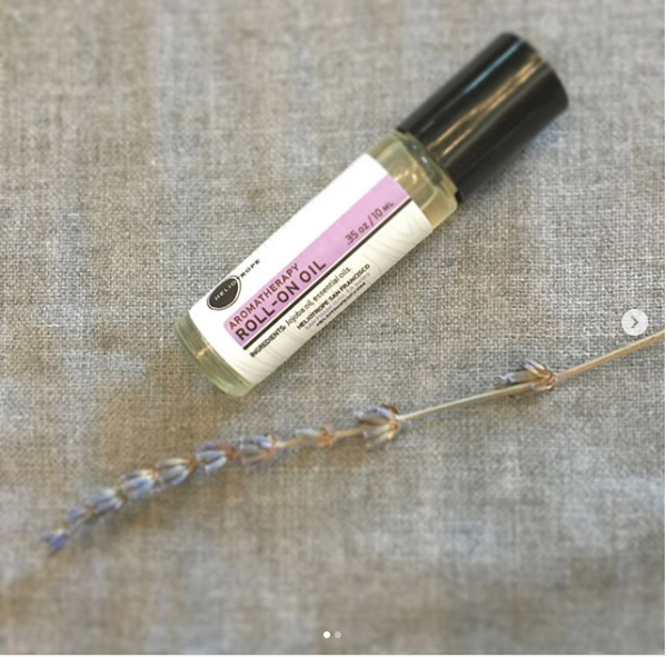 Aromatherapy Roll-On Oil in a frosted glass vial with a roll-on applicator, showcasing its natural essential oil blends.