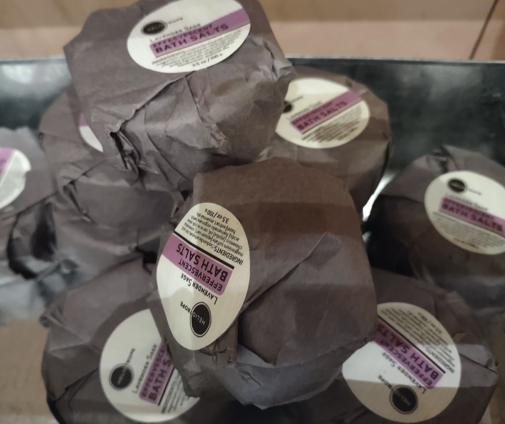 Aromatherapy Shower Steamers in biodegradable packaging, showcasing their disc shape and natural ingredients.