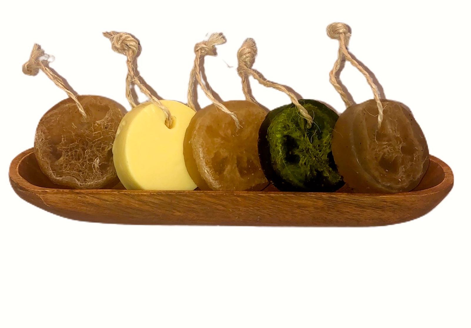 Artisanal Soap Collection featuring various natural soap bars with loofah and hanging cord, showcasing vibrant colors and textures.