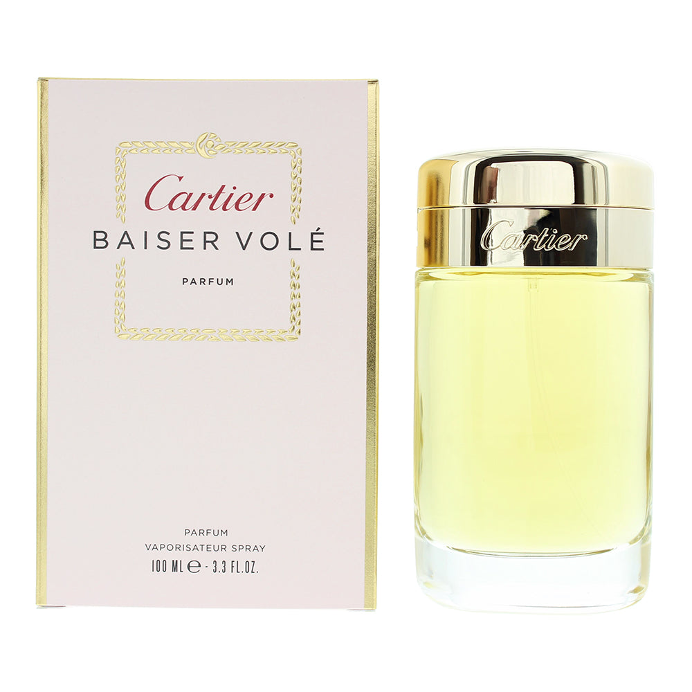 Cartier Baiser Volé Parfum bottle elegantly displayed with floral accents.