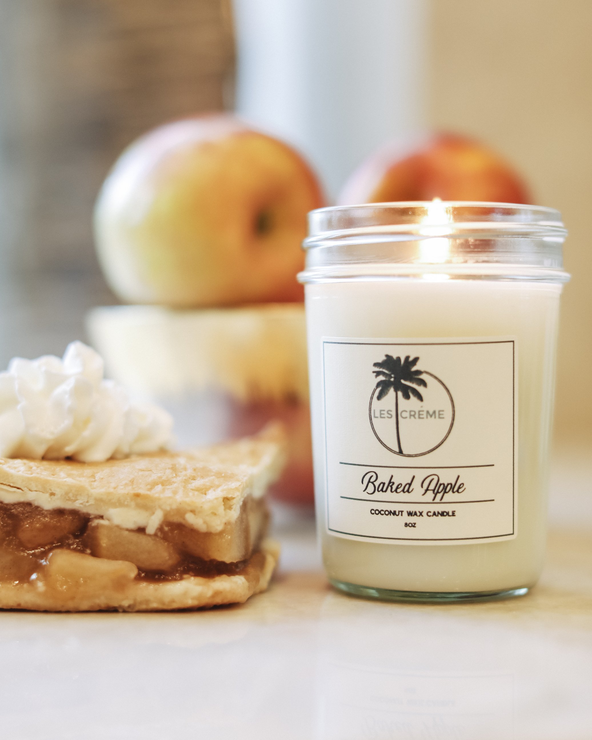 Baked Apple Scent Coconut Wax Candle in a glass jar, showcasing its warm, inviting color and natural ingredients.