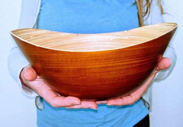 A beautifully crafted walnut bamboo bowl, perfect for gift baskets, showcasing a classic design and natural finish.