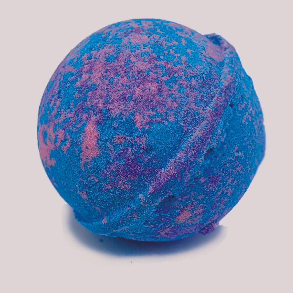 A colorful Birthday Cake Bath Bomb with a sweet vanilla and lemon scent, perfect for a festive bath experience.