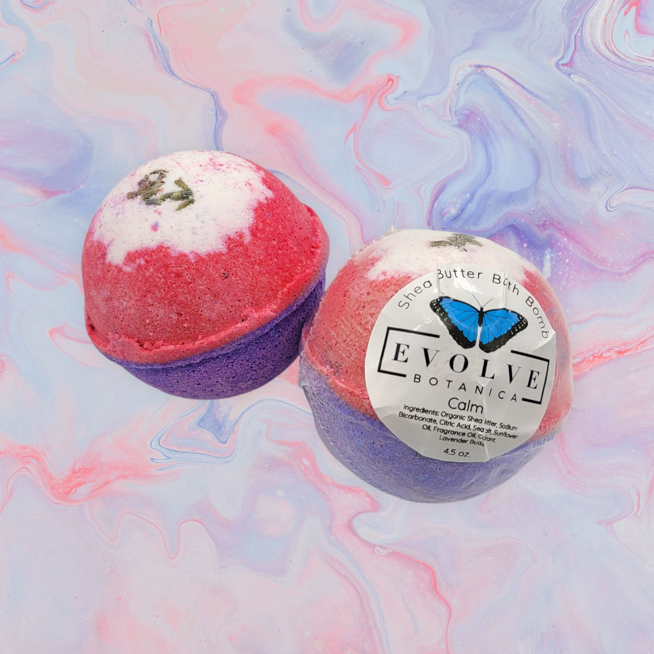 Just Calm Down Bath Bomb with glitter, featuring a crisp and clean earthy scent, surrounded by bath accessories.