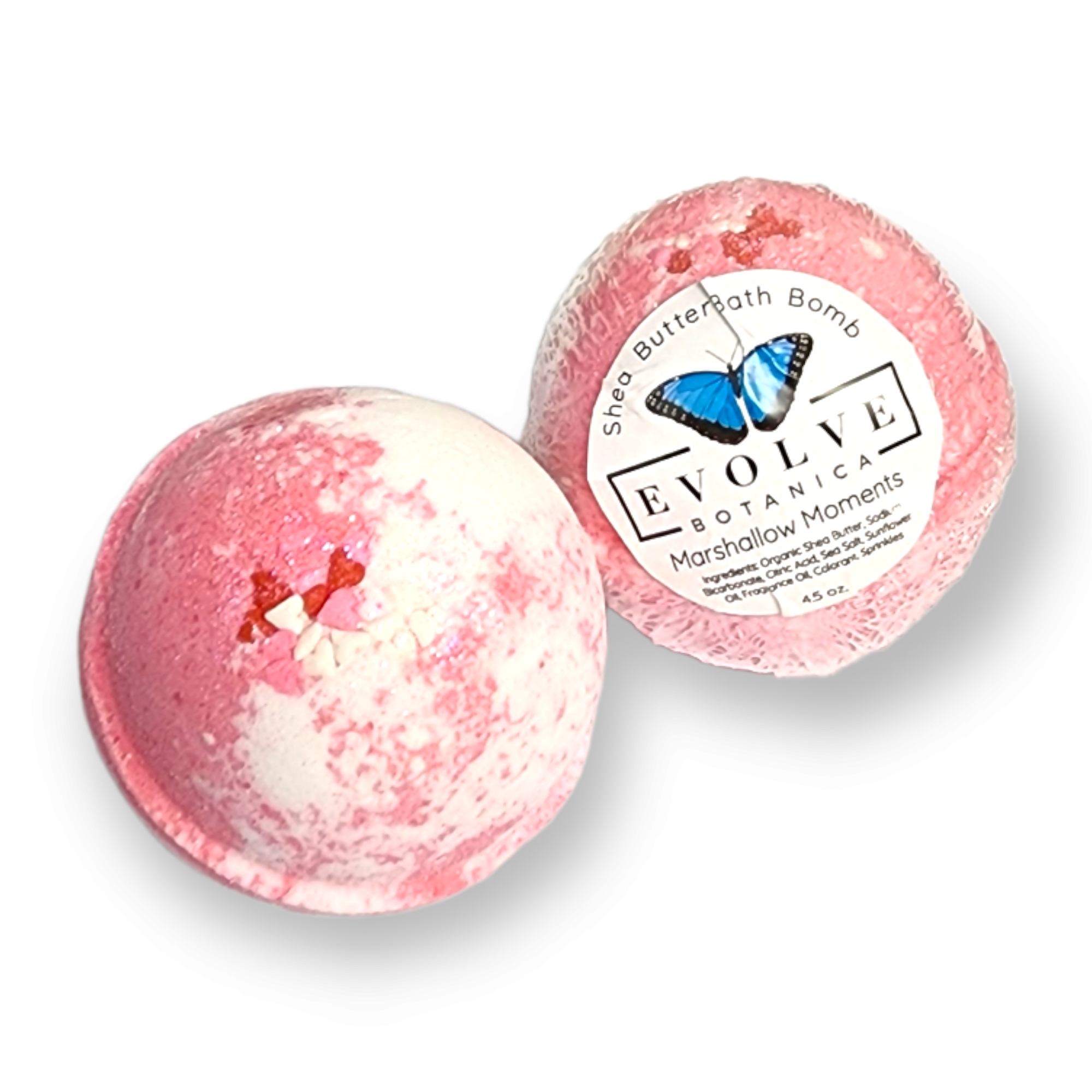 A colorful Marshmallow Moments Bath Bomb with swirls of pink and white, surrounded by marshmallows and sugared plums.