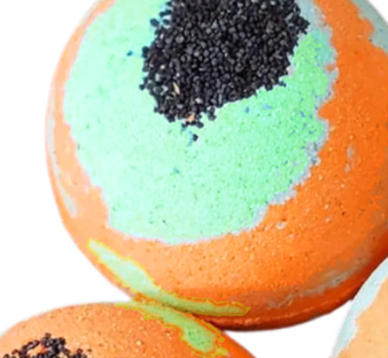 A vibrant Pumpkin Patch Bath Bomb with autumn colors, featuring pumpkin and spice motifs, resting on a wooden surface.