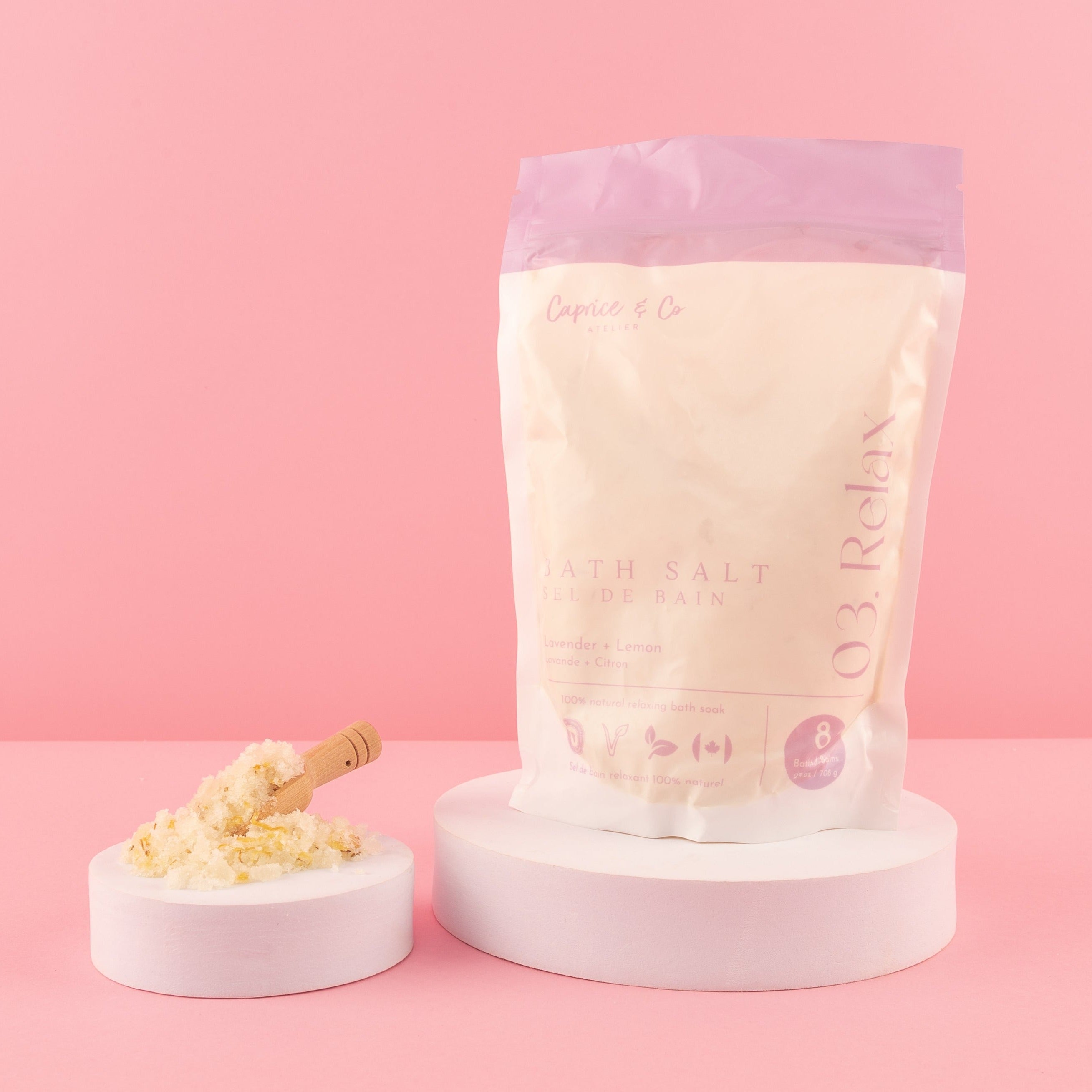 A collection of all-natural bath salts in various scents, showcasing colorful crystals and essential oils in elegant packaging.