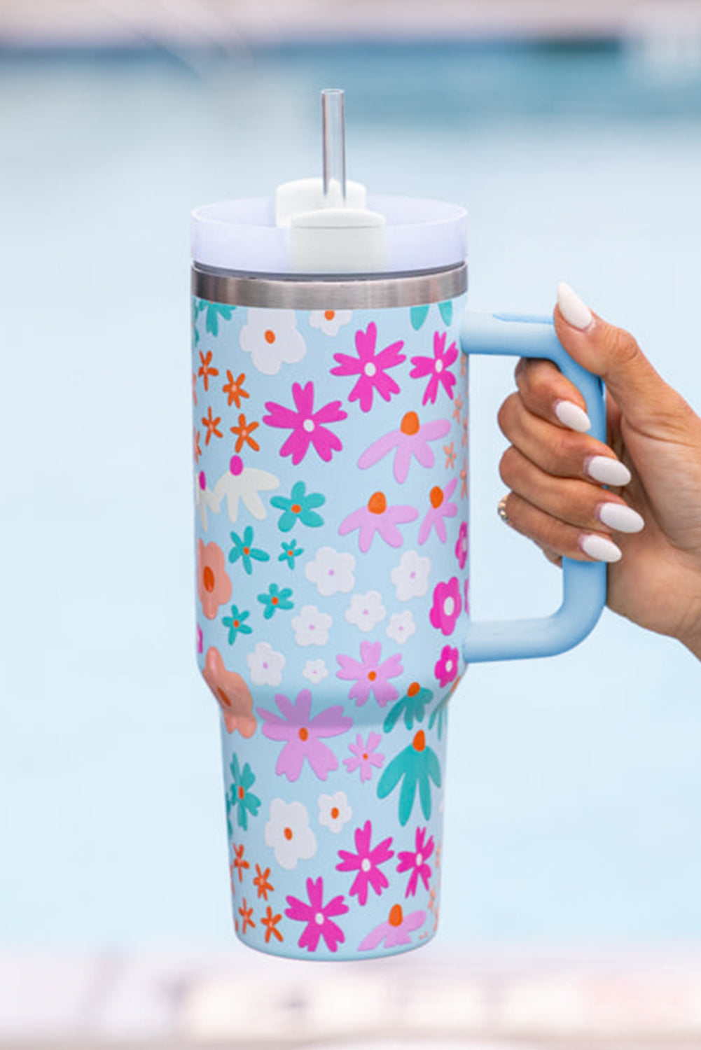 Beau Blue Cute Flower Pattern Handled Cup with Straw, featuring a vibrant floral design and a sturdy handle for easy carrying.