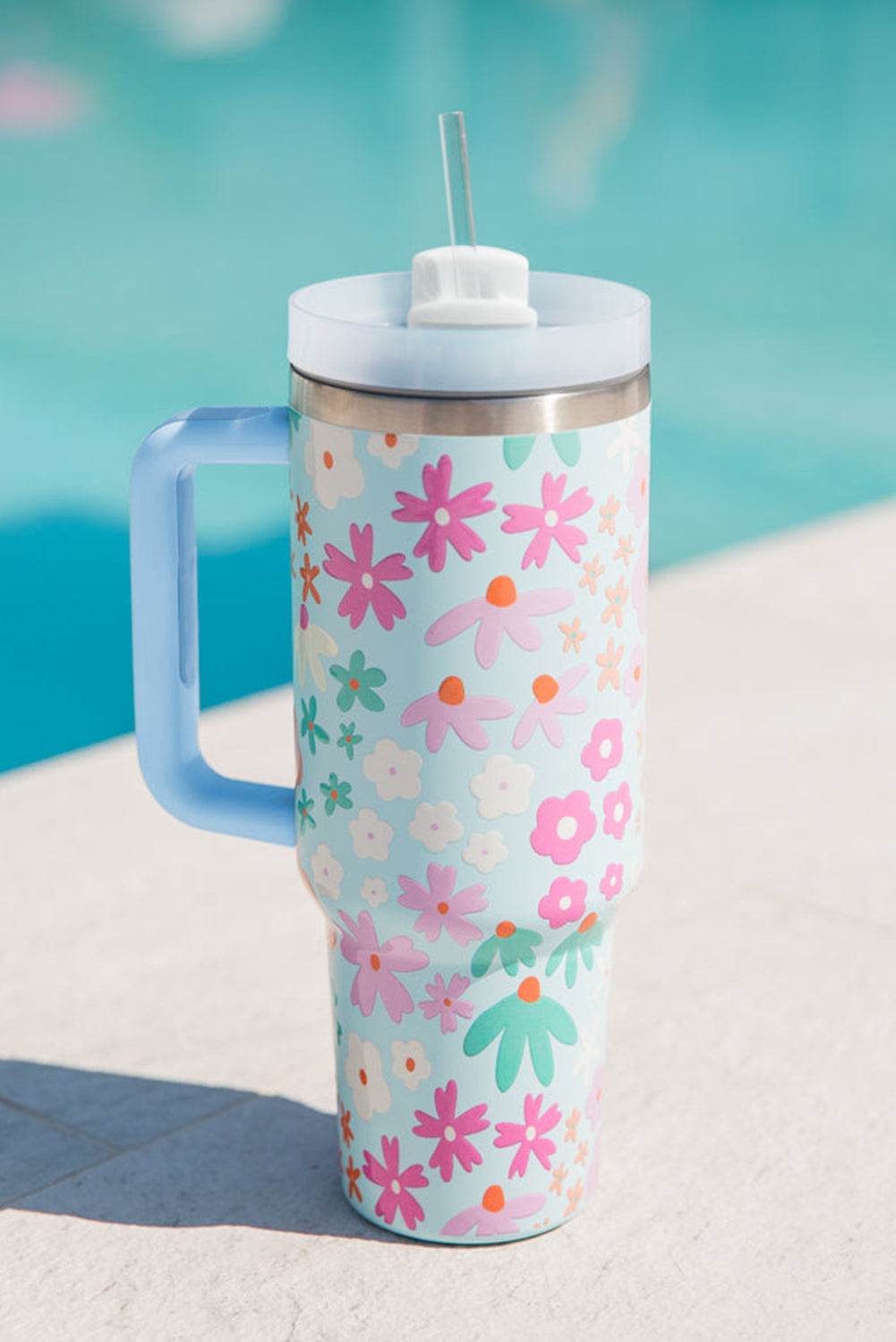 Beau Blue Cute Flower Pattern Handled Cup with Straw, featuring a vibrant floral design and a sturdy handle for easy carrying.