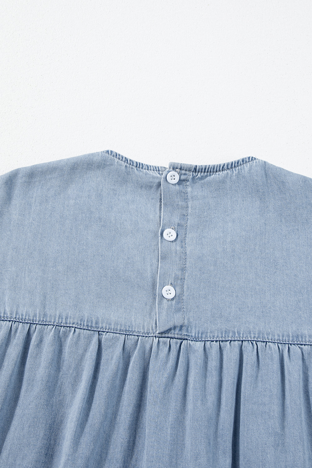 Beau Blue Ruffle Short Sleeve Tiered A-line Denim Dress displayed on a mannequin, showcasing its stylish design and ruffle sleeves.