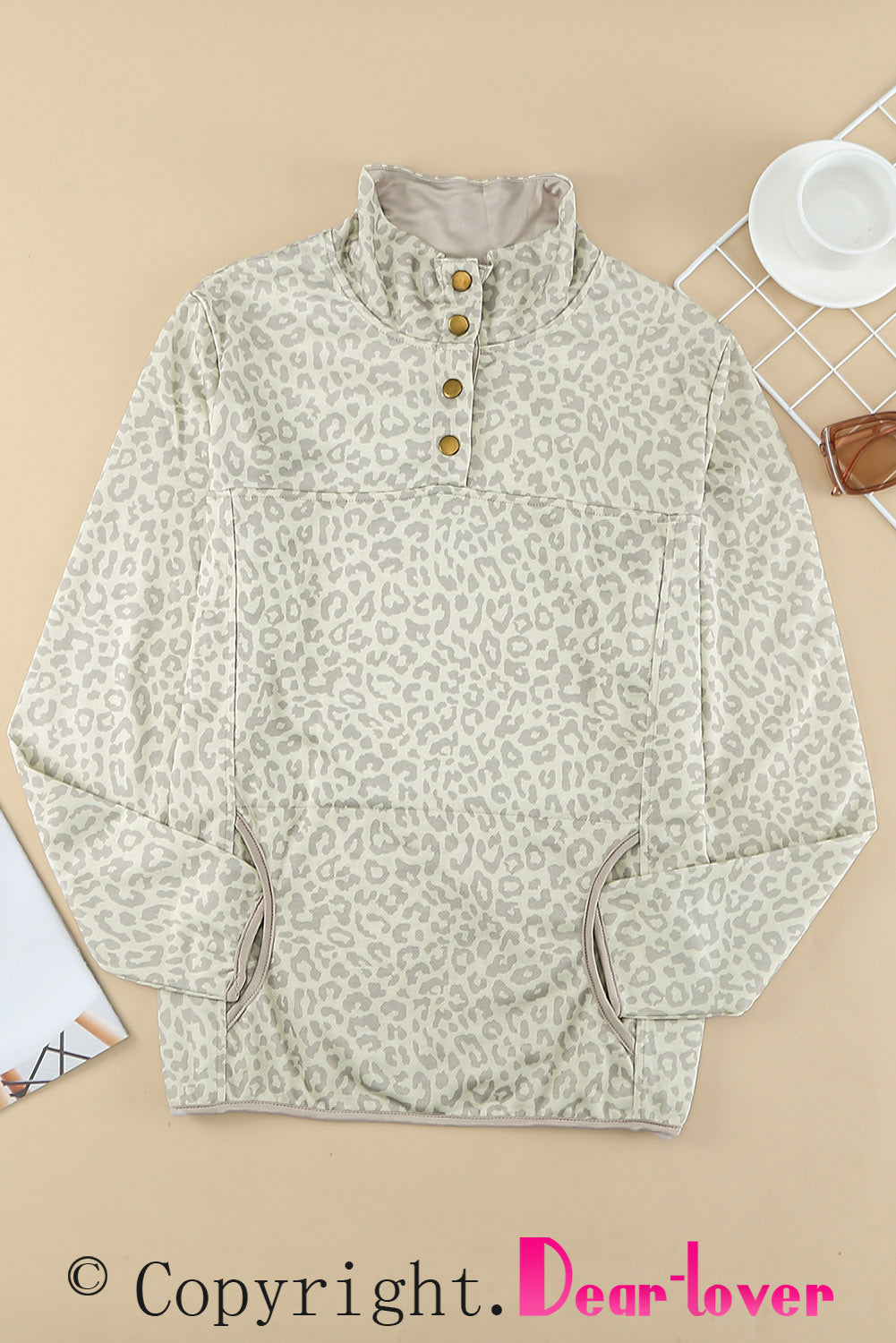 Beige lapel sweatshirt with leopard print, featuring a snap front and kangaroo pocket, perfect for casual wear.