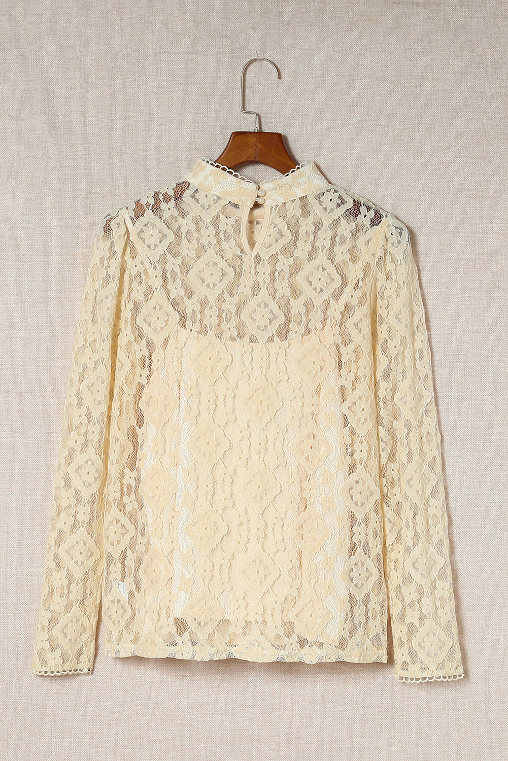 Beige Mock Neck Lace Blouse with intricate lace detailing and long sleeves, perfect for stylish layering.