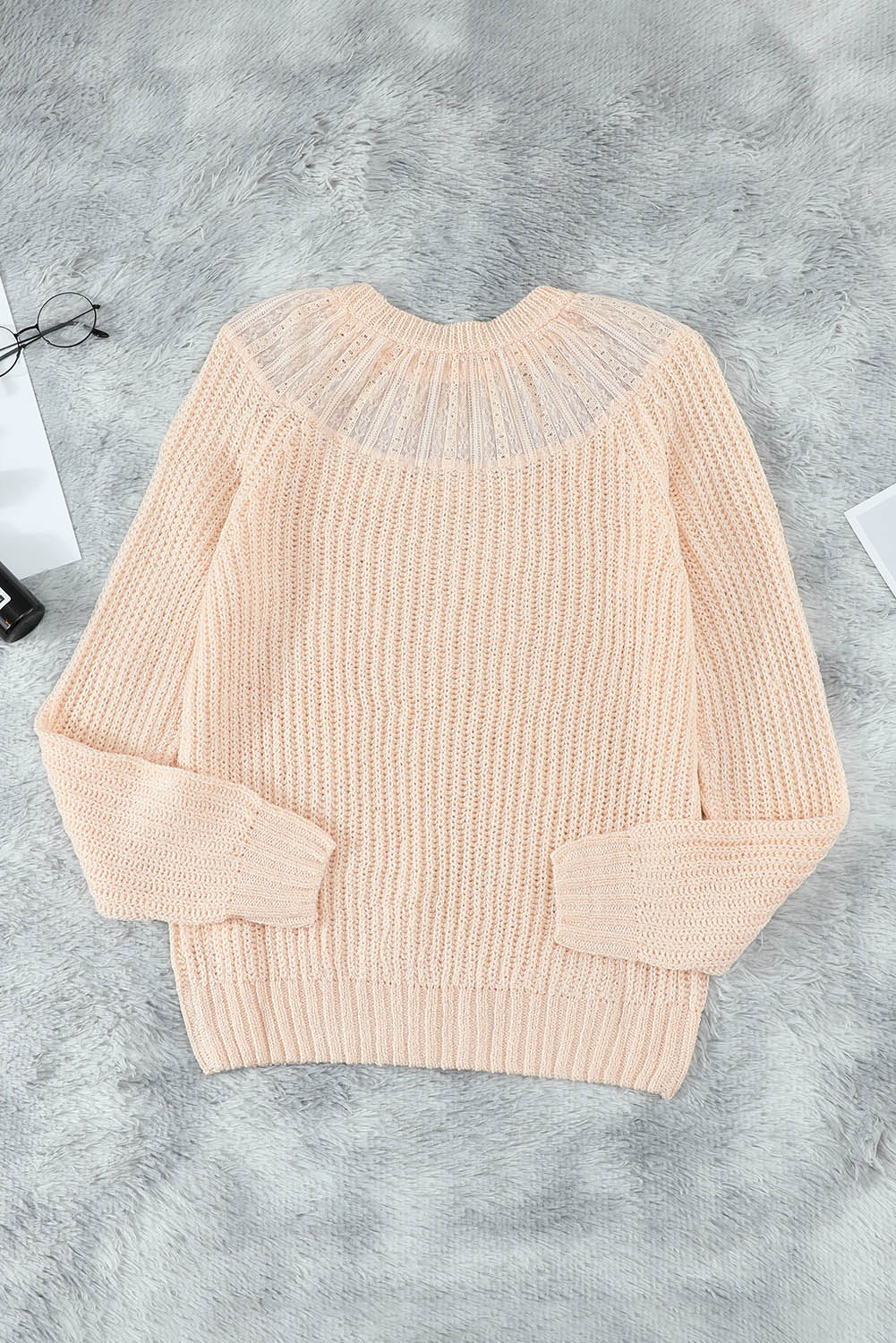 Beige knitted sweater featuring round neck and lace splicing details, perfect for stylish layering in chilly weather.