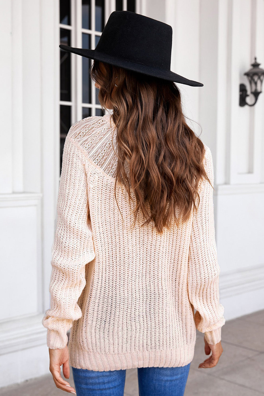 Beige knitted sweater featuring round neck and lace splicing details, perfect for stylish layering in chilly weather.