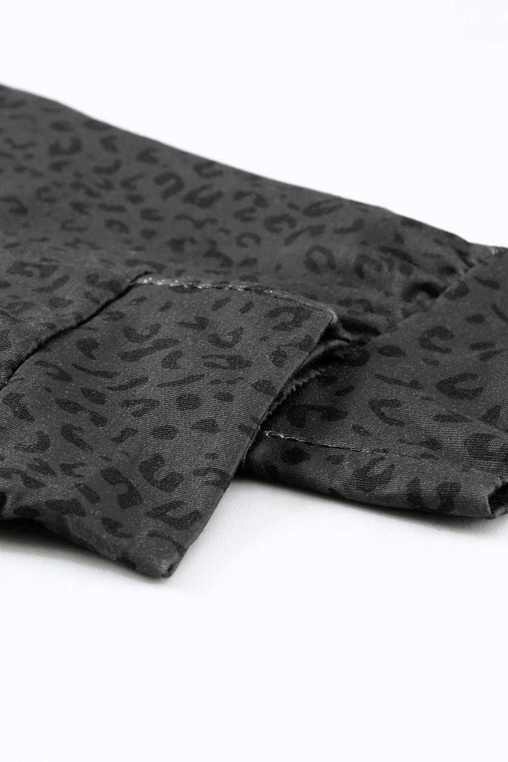 Black Breezy Leopard Joggers featuring a stylish leopard print and adjustable smocked waist, perfect for casual wear.