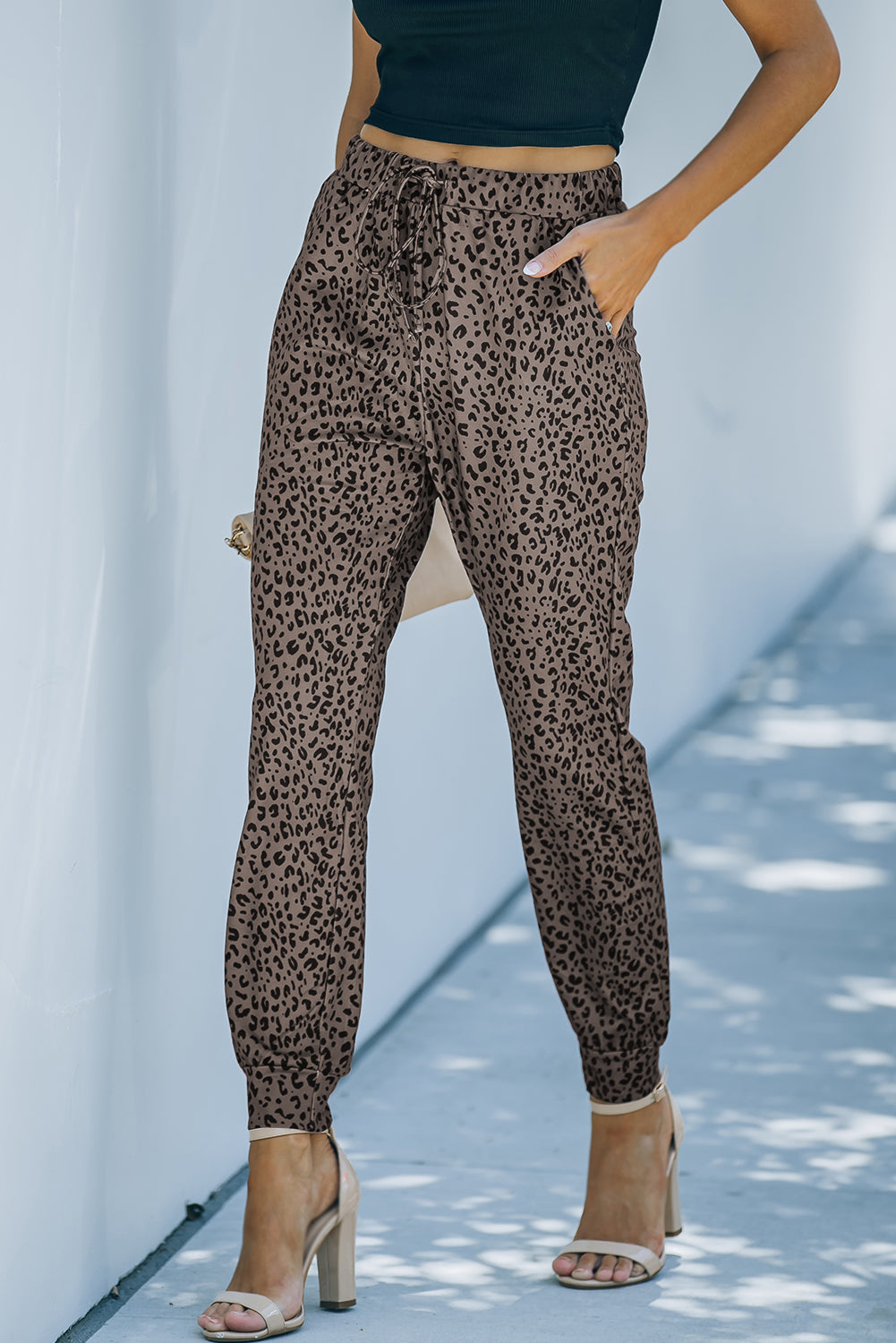 Black Breezy Leopard Joggers featuring a stylish leopard print and adjustable smocked waist, perfect for casual wear.