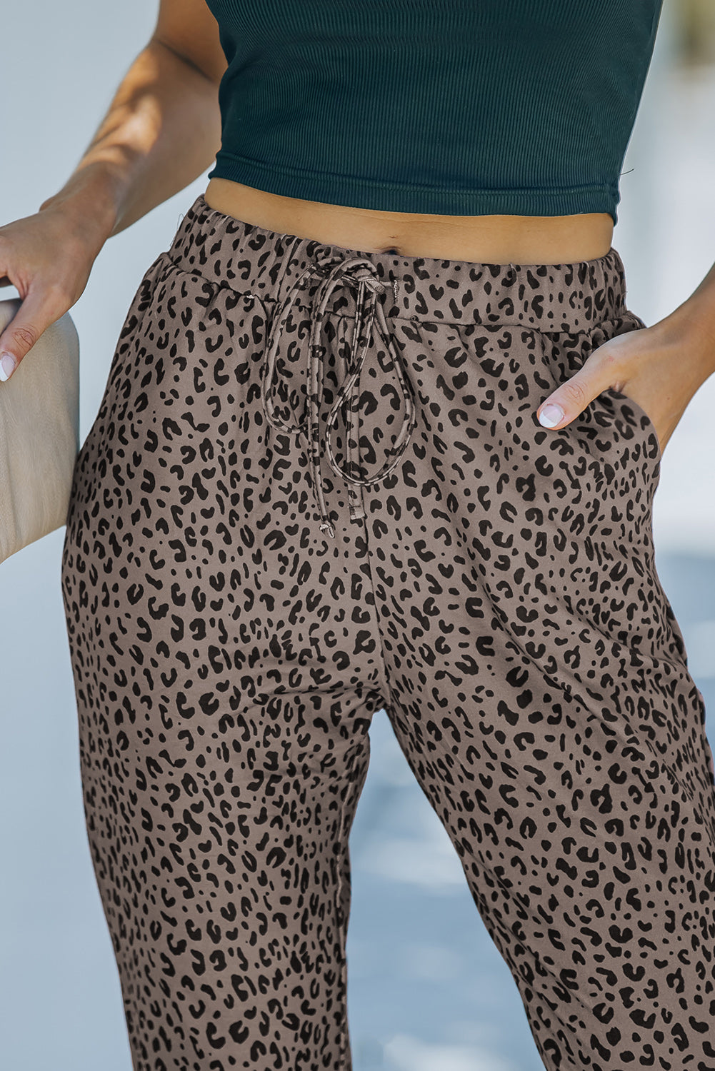 Black Breezy Leopard Joggers featuring a stylish leopard print and adjustable smocked waist, perfect for casual wear.