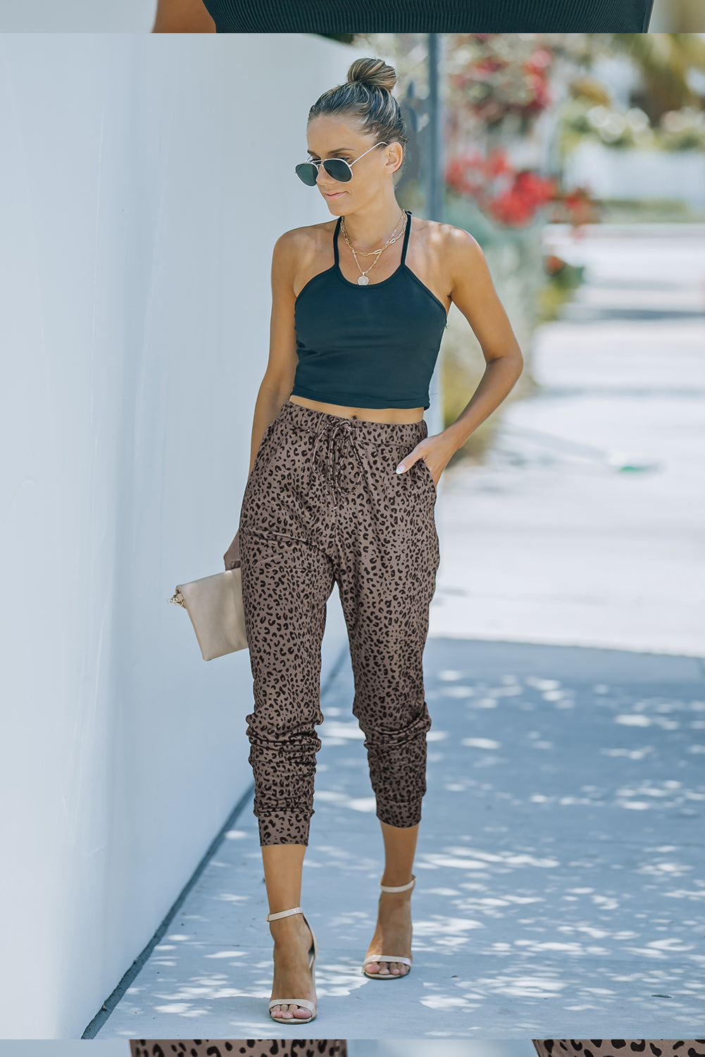 Black Breezy Leopard Joggers featuring a stylish leopard print and adjustable smocked waist, perfect for casual wear.