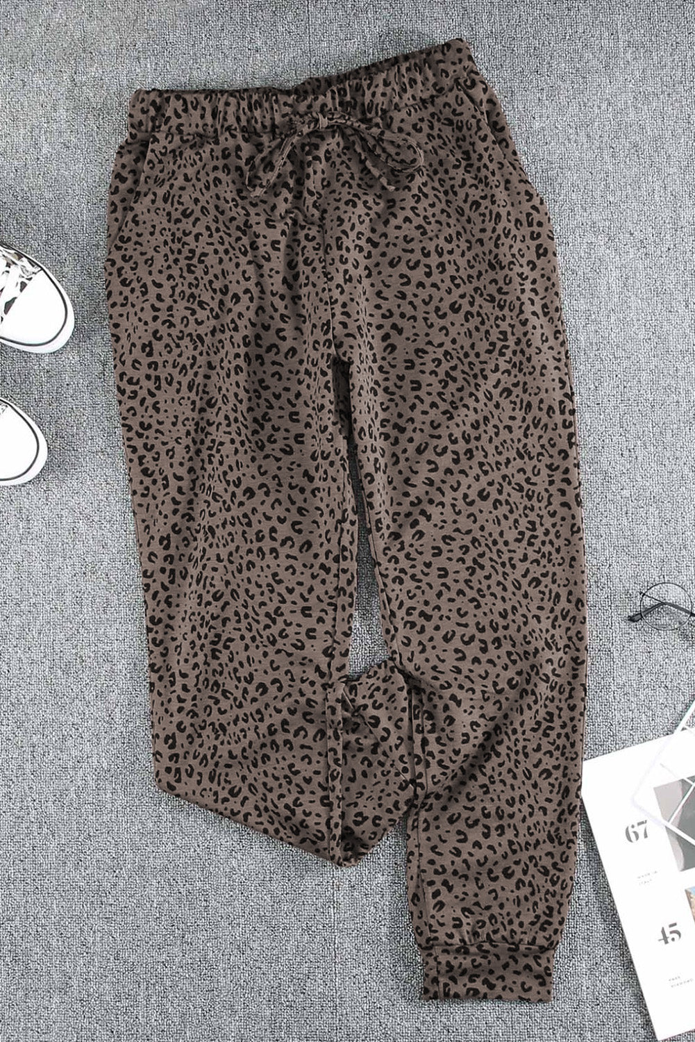 Black Breezy Leopard Joggers featuring a stylish leopard print and adjustable smocked waist, perfect for casual wear.