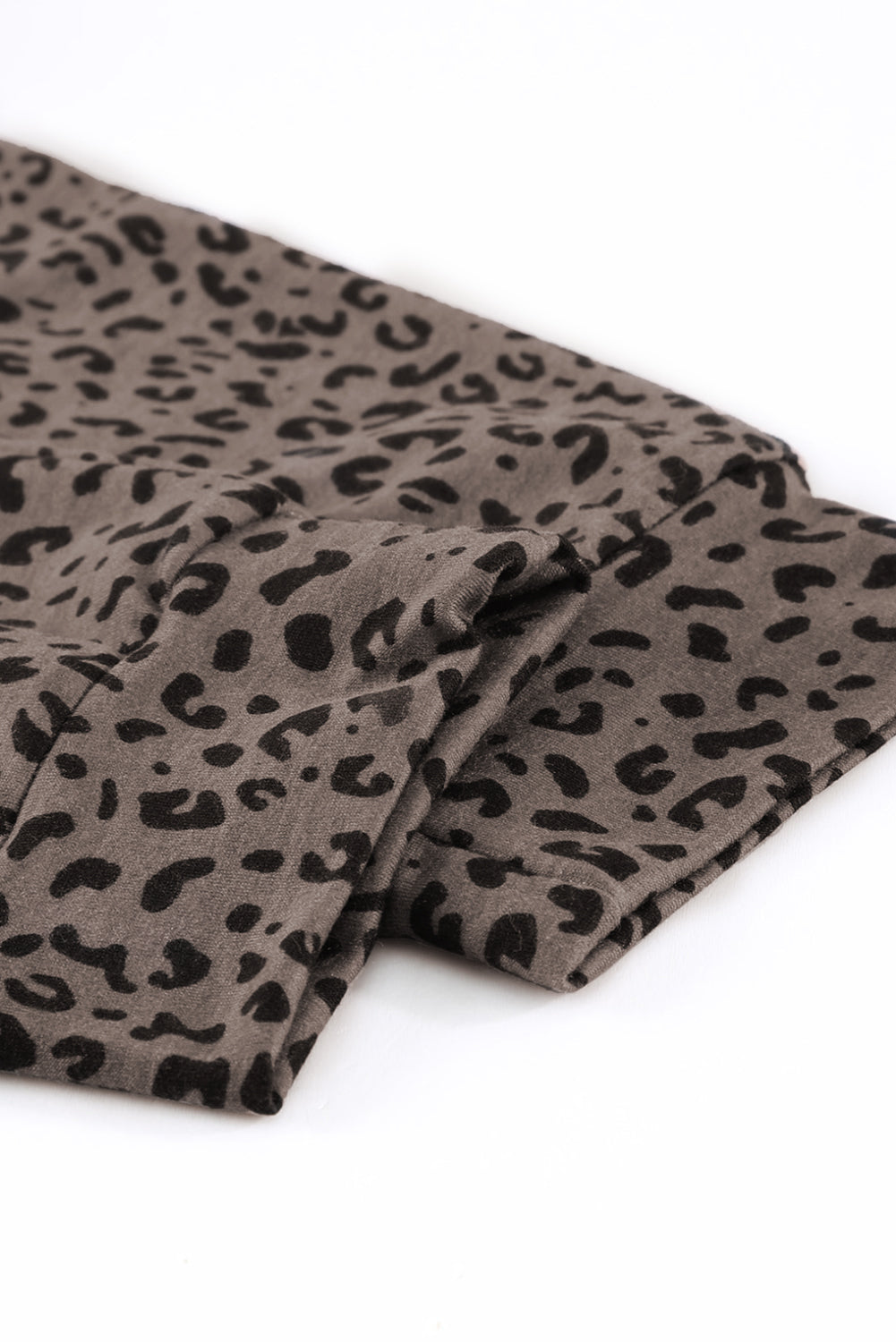 Black Breezy Leopard Joggers featuring a stylish leopard print and adjustable smocked waist, perfect for casual wear.