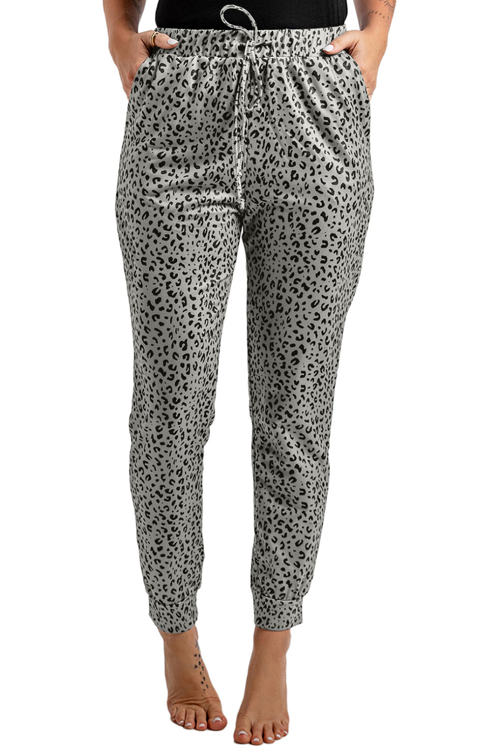 Black Breezy Leopard Joggers featuring a stylish leopard print and adjustable smocked waist, perfect for casual wear.