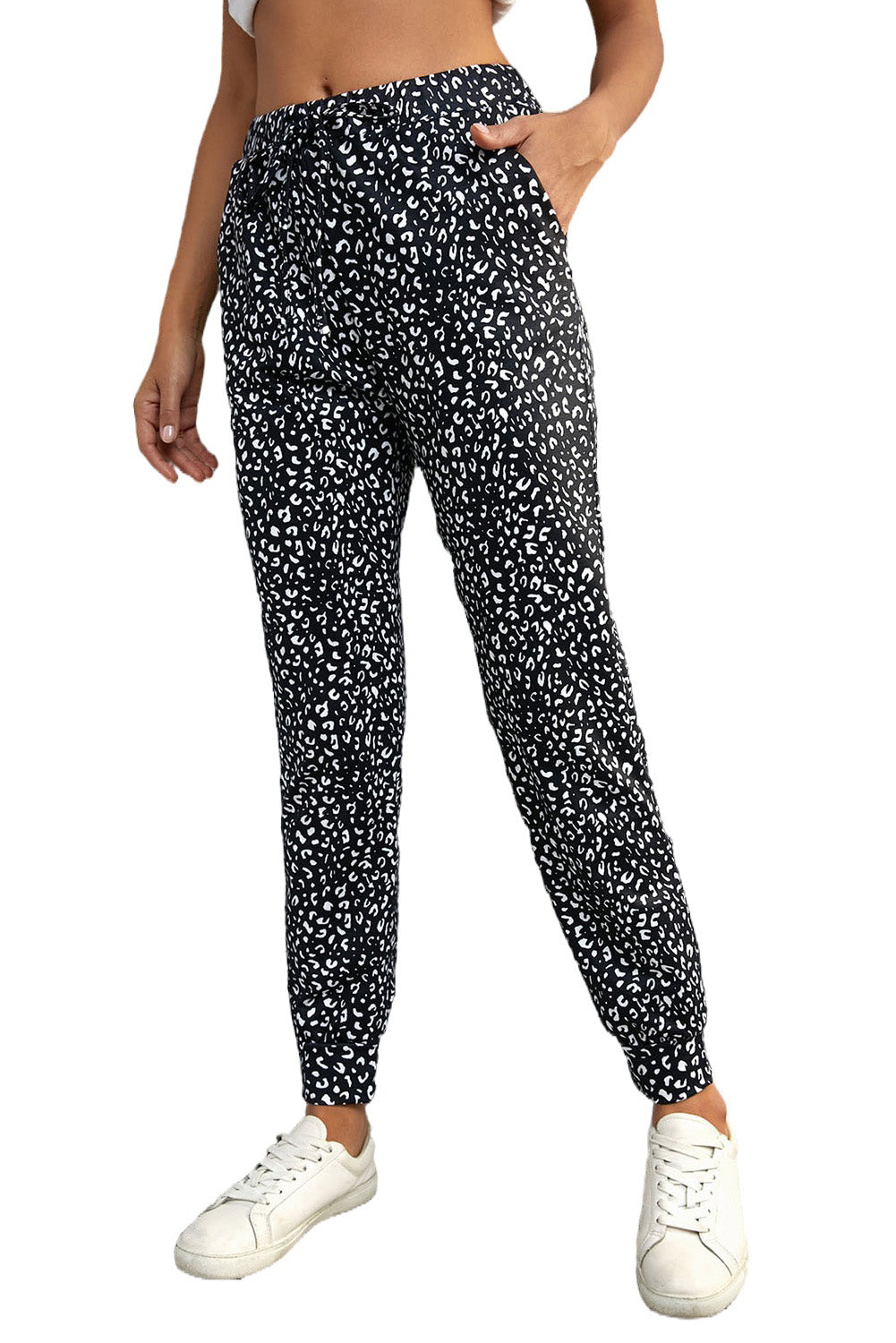 Black Breezy Leopard Joggers featuring a stylish leopard print and adjustable smocked waist, perfect for casual wear.