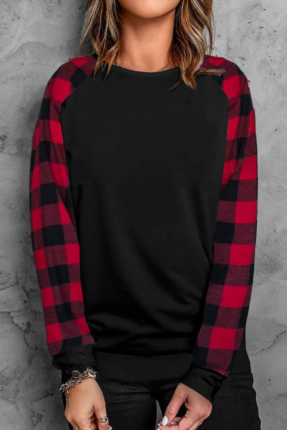 Black Buffalo Plaid Long Sleeve Sweatshirt featuring a cozy cotton blend fabric and stylish patchwork design.