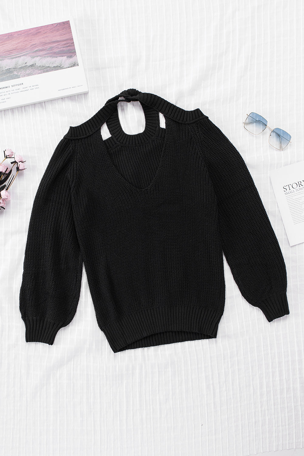 A stylish black casual loose halter neck sweater featuring cold shoulder cutouts and ribbed knit fabric, perfect for versatile styling.