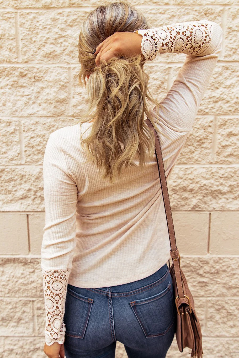 Black Crochet Lace Hem Sleeve Button Top featuring elegant lace sleeves and a stylish half-open collar.