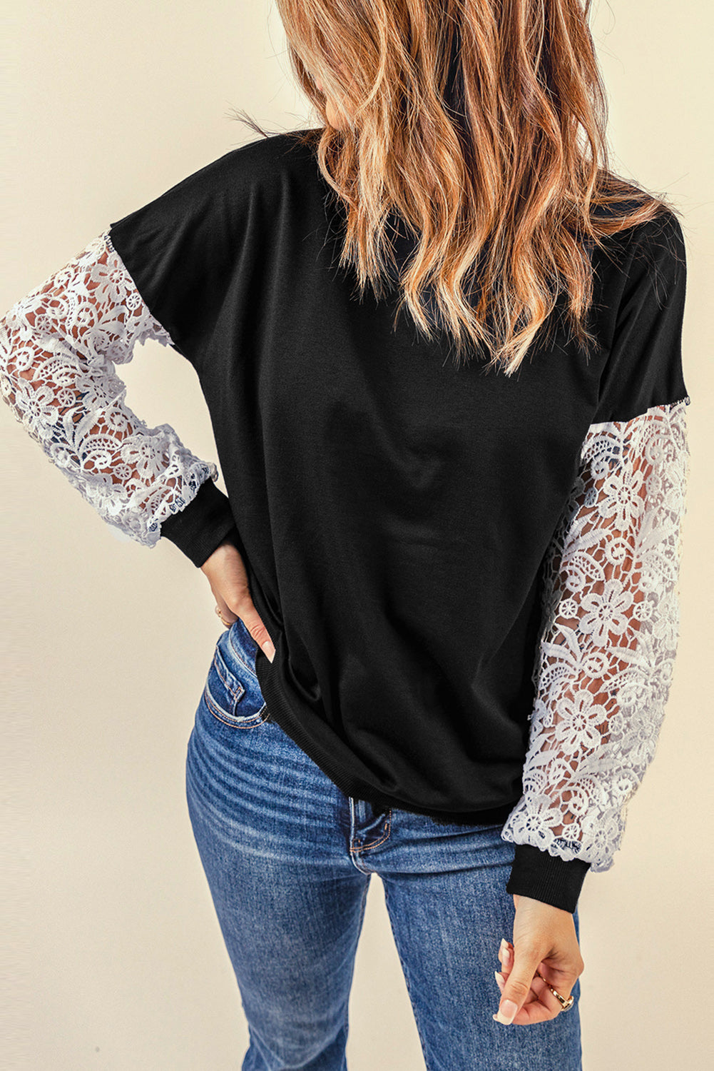 Black Crochet Lace Sleeve Top featuring elegant lace splicing sleeves and a casual chic pullover design, suitable for various body shapes.