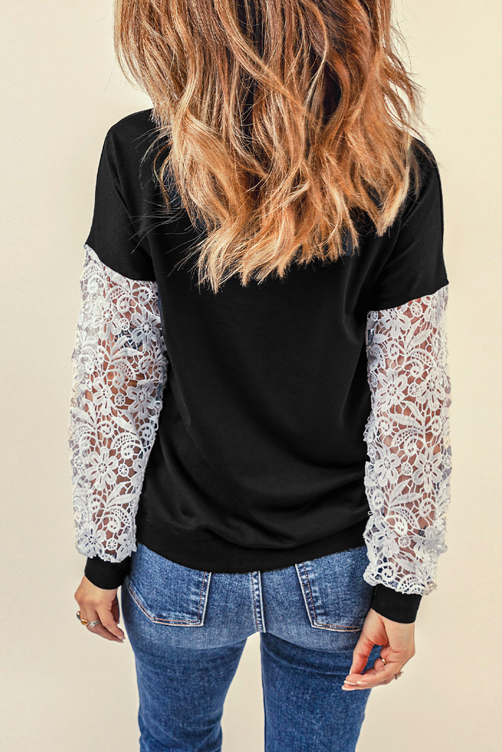 Black Crochet Lace Sleeve Top featuring elegant lace splicing sleeves and a casual chic pullover design, suitable for various body shapes.