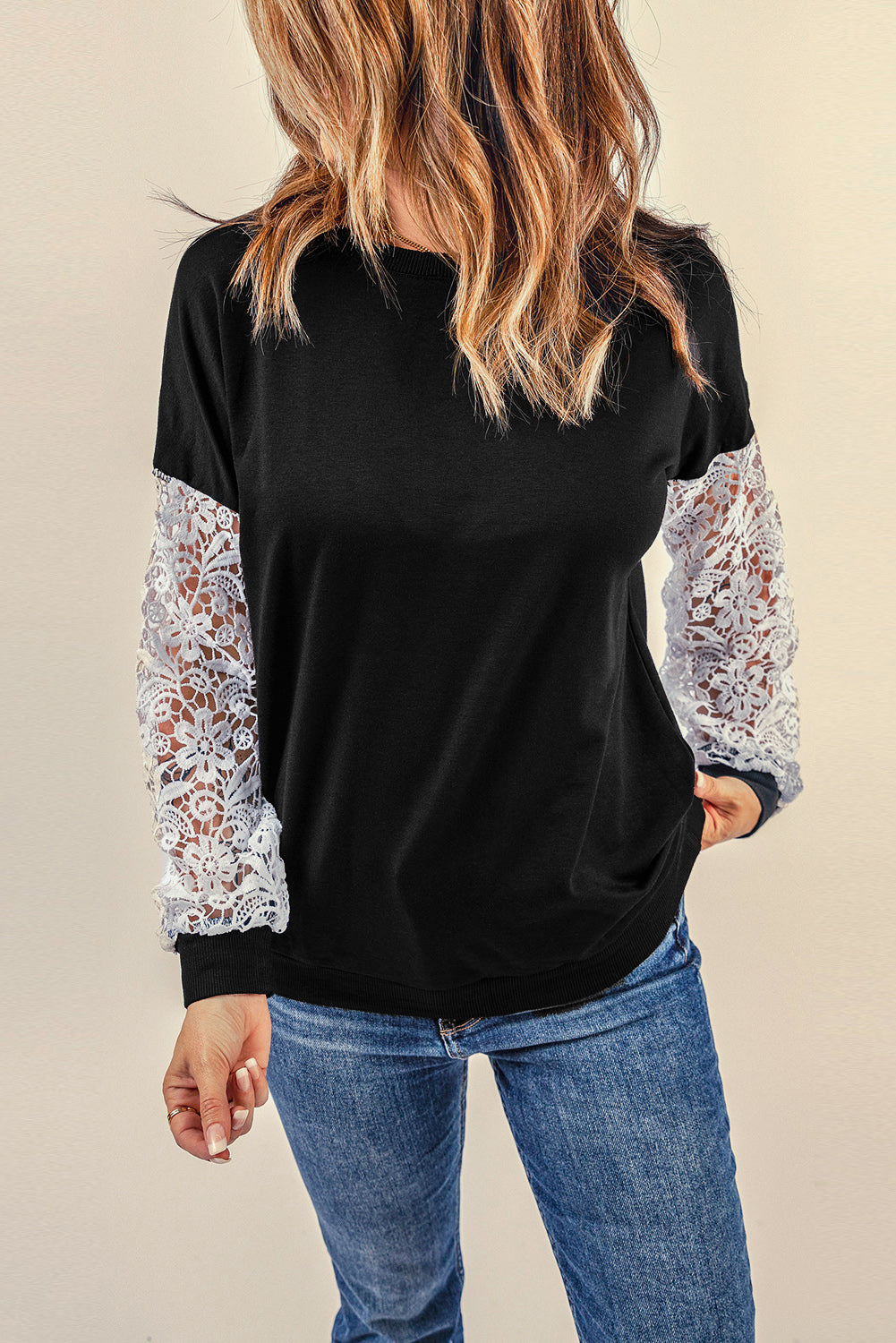 Black Crochet Lace Sleeve Top featuring elegant lace splicing sleeves and a casual chic pullover design, suitable for various body shapes.