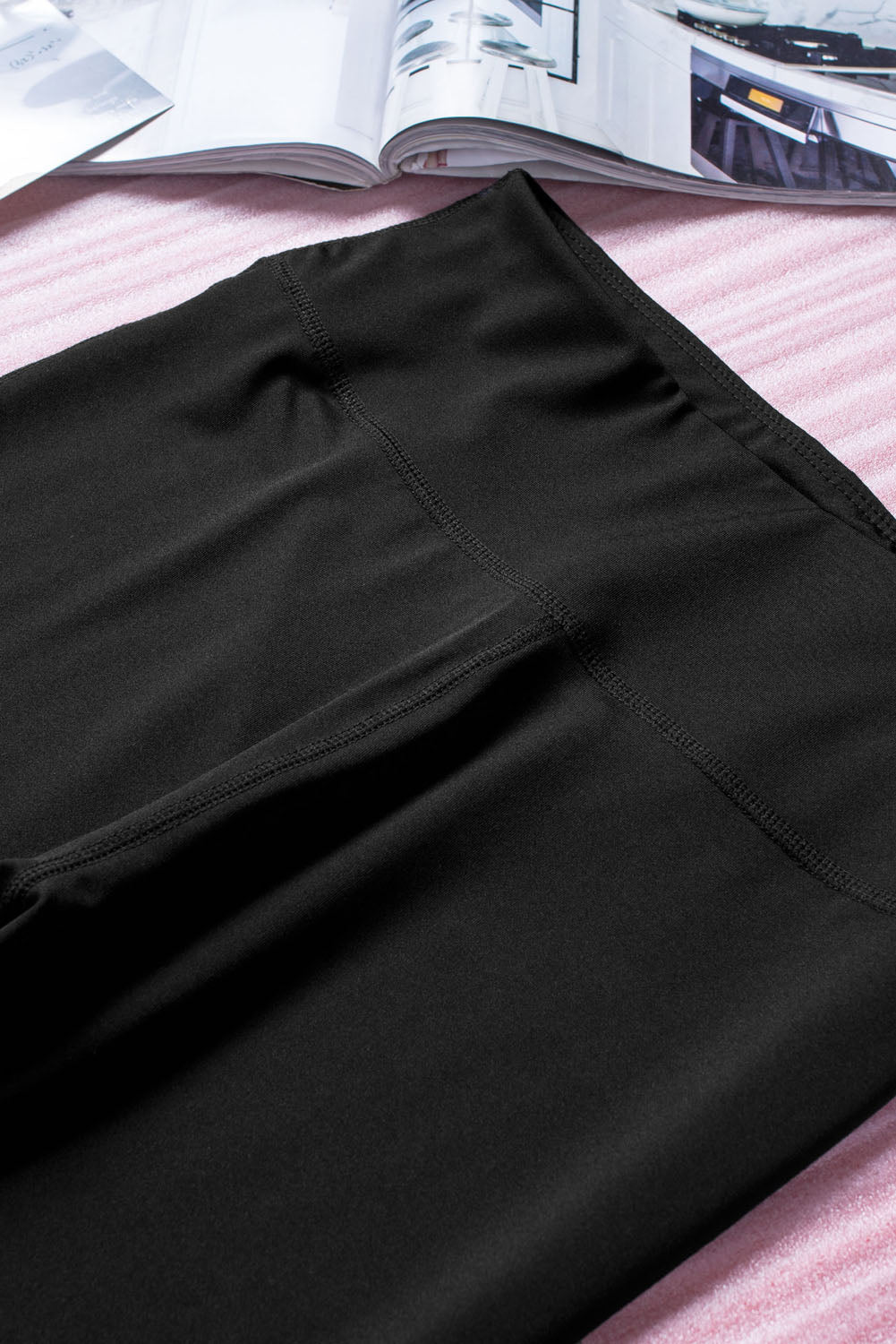 Black cut-out skinny high waist leggings showcasing a trendy design and high elastic material, perfect for stylish women.