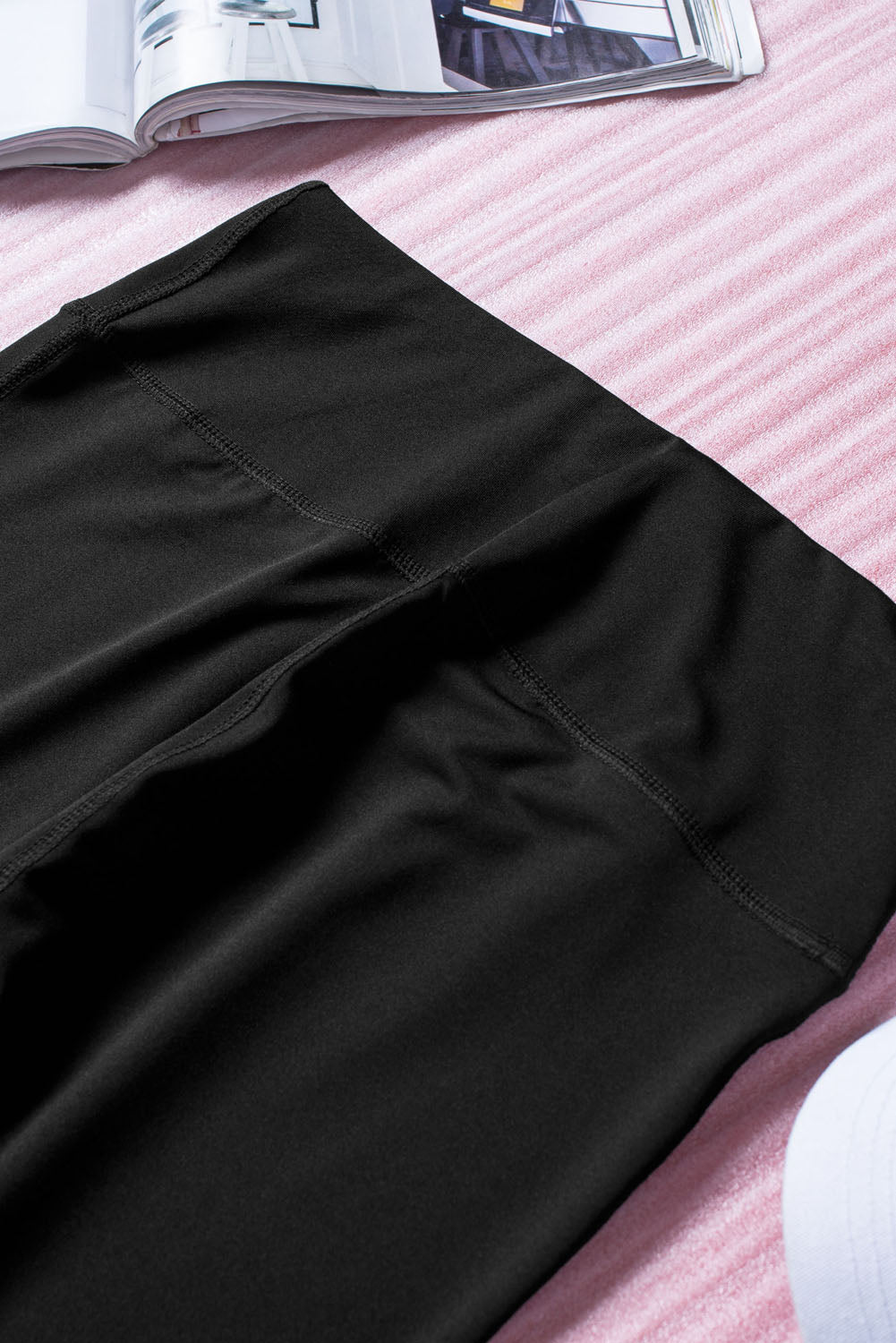 Black cut-out skinny high waist leggings showcasing a trendy design and high elastic material, perfect for stylish women.