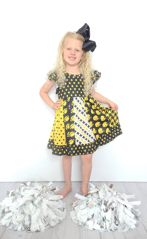 A stylish Black Football Star Girl Dress featuring a soft fabric and a fun football star design, perfect for casual wear.