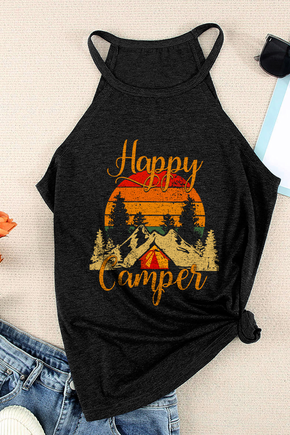 Black tank top featuring a 'Happy Camper' graphic print, designed for casual summer wear with a slim fit.